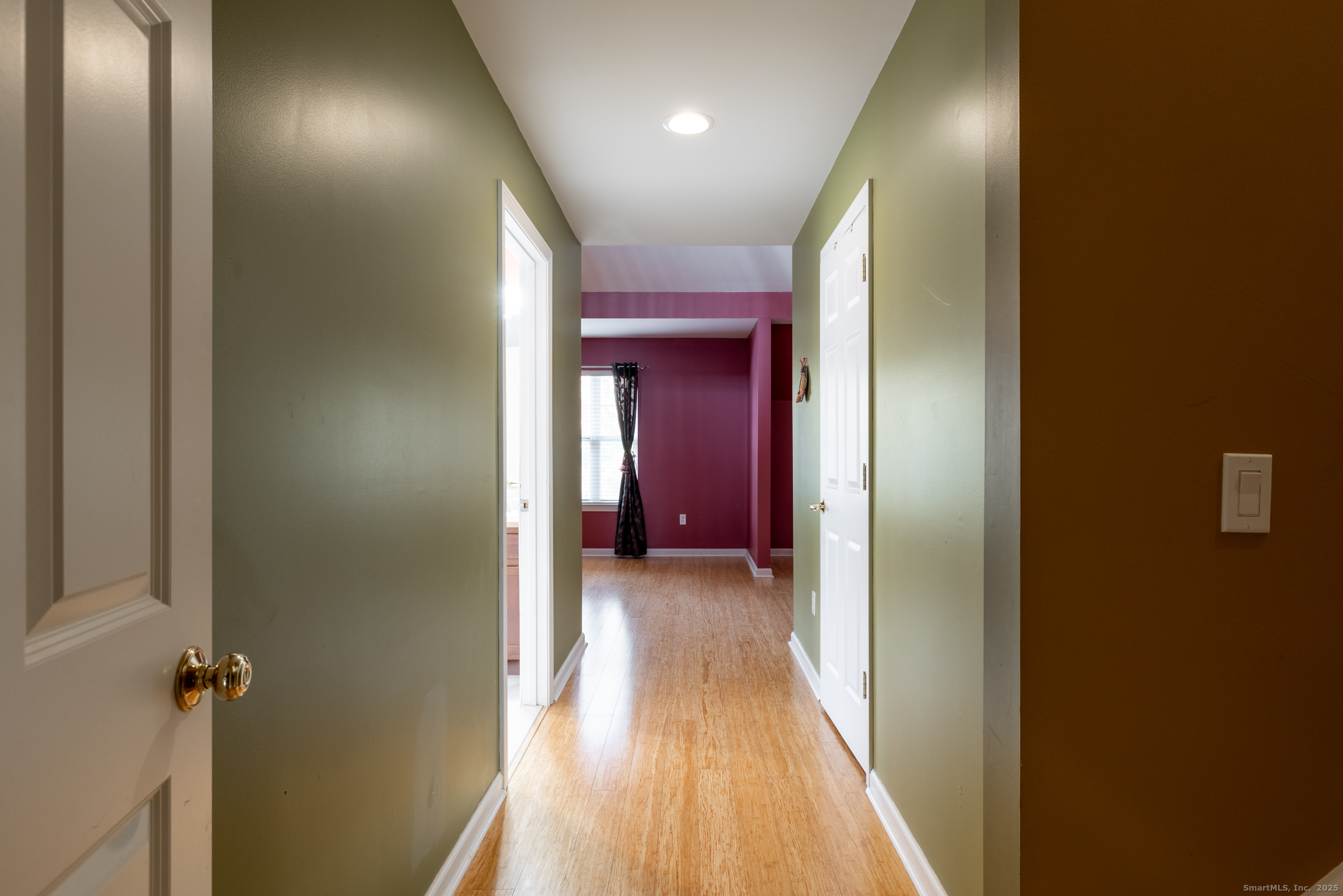 49 Park Pl Circle, Unit 49 West Hartford, CT 06110 - Photo 13 of 33 a view of a hallway with wooden floor