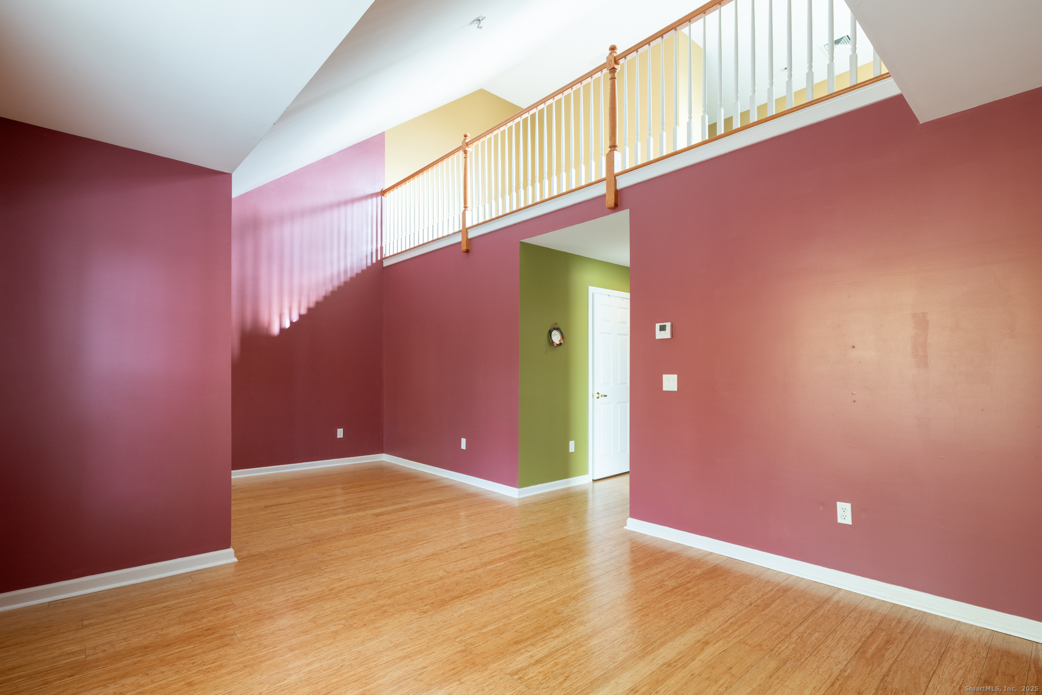 49 Park Pl Circle, Unit 49 West Hartford, CT 06110 - Photo 19 of 33 a view of a big room with wooden floor