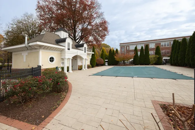 a room with wooden floors and pool table