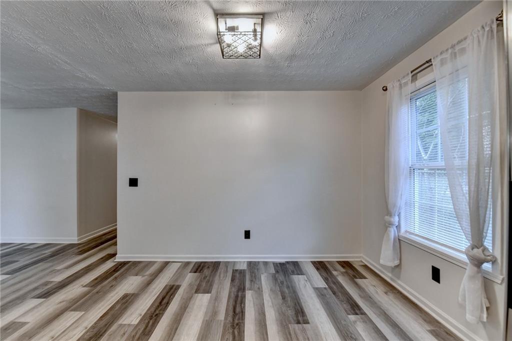 801 Davis Street Monroe, GA 30655 - Photo 14 of 33 a view of an empty room with a window