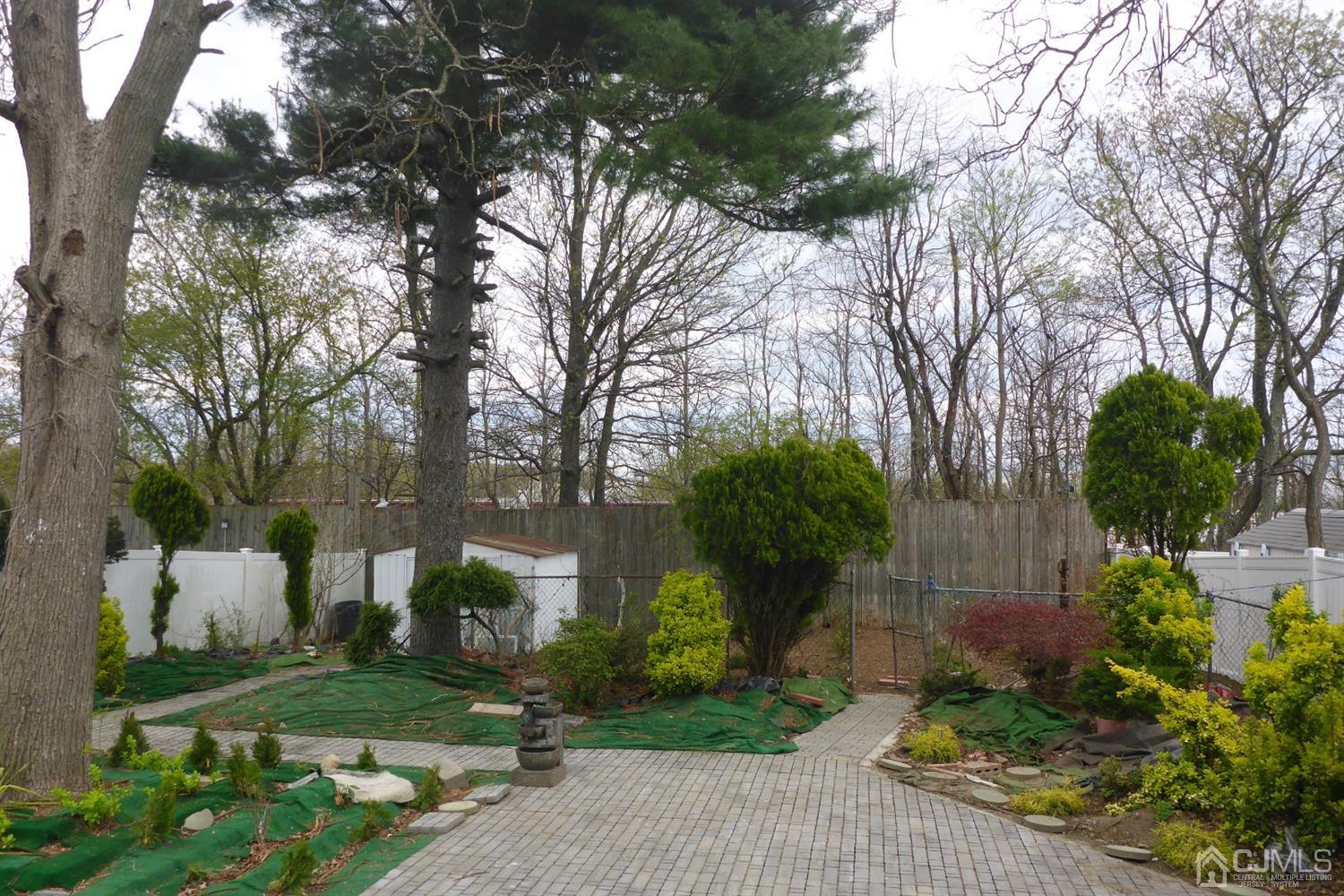 25 Wilshire Road Edison, NJ 08817 - Photo 12 of 18 a front view of a house with garden