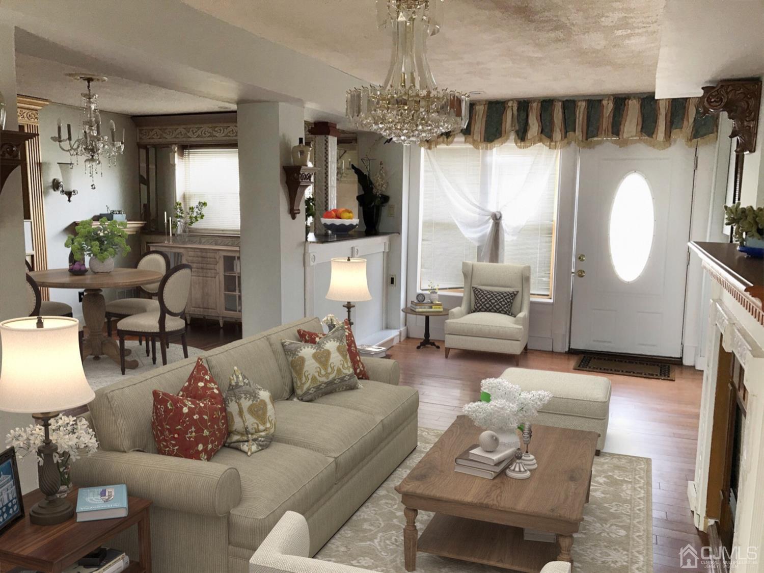 25 Wilshire Road Edison, NJ 08817 - Photo 13 of 18 a living room with furniture a fireplace and a chandelier