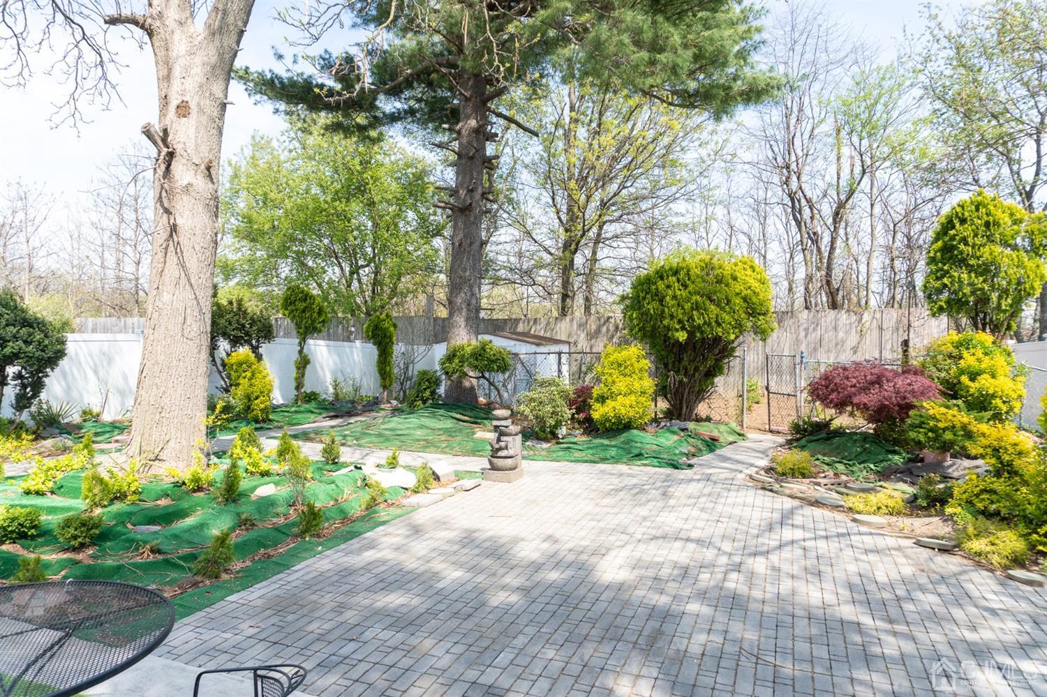 25 Wilshire Road Edison, NJ 08817 - Photo 14 of 18 a front view of a house with garden
