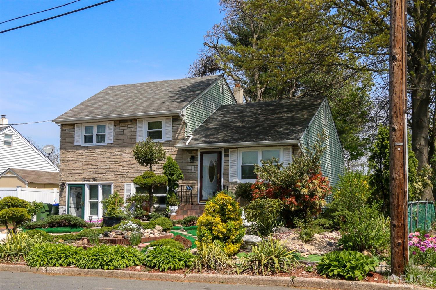 25 Wilshire Road Edison, NJ 08817 - Photo 17 of 18 a front view of a house with garden