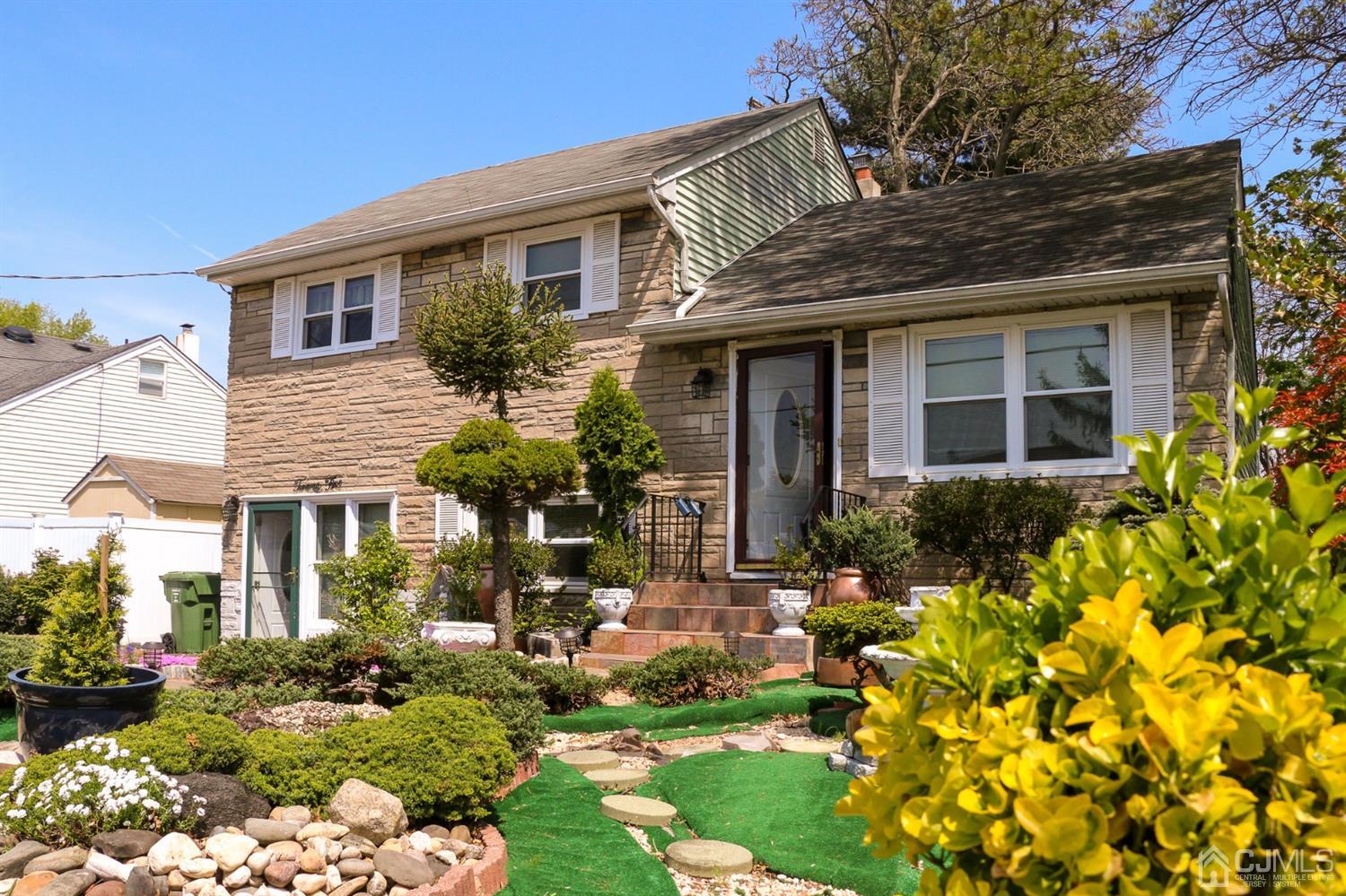 25 Wilshire Road Edison, NJ 08817 - Photo 18 of 18 a front view of a house with a yard and flowers