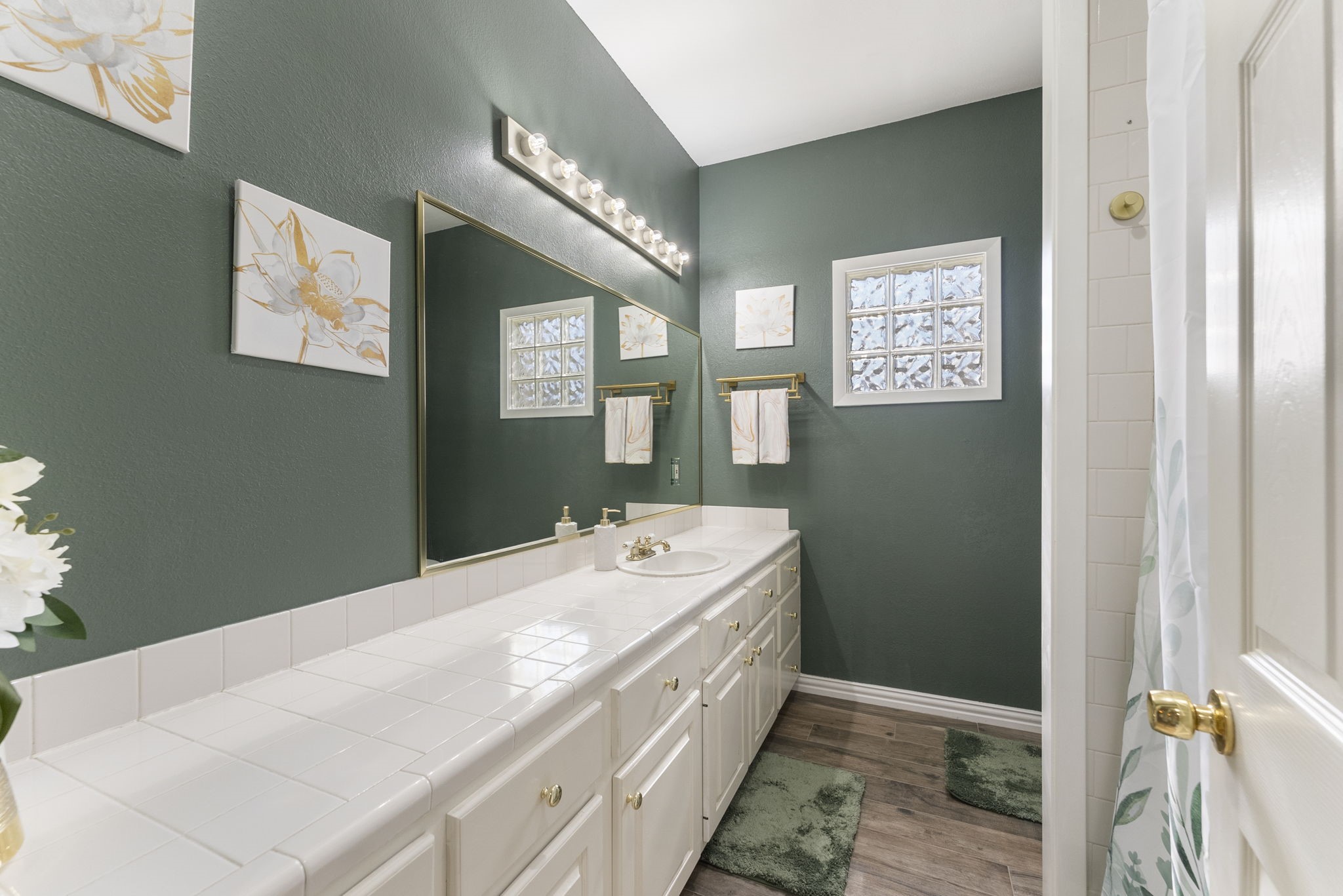 13942 Longstreet Road Willis, TX 77318 - Photo 19 of 46 a spacious bathroom with a sink and a mirror