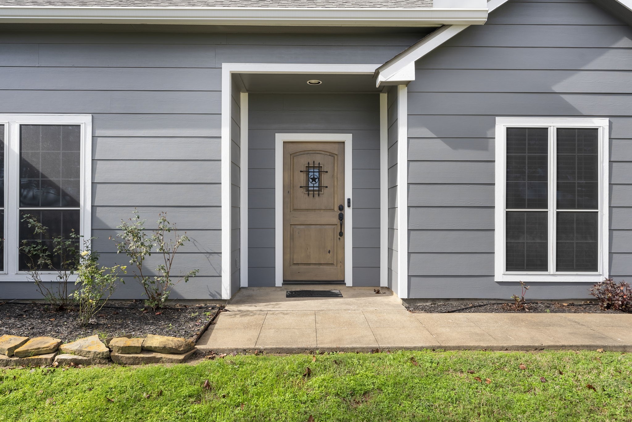 13942 Longstreet Road Willis, TX 77318 - Photo 2 of 46 a front view of a house with a yard