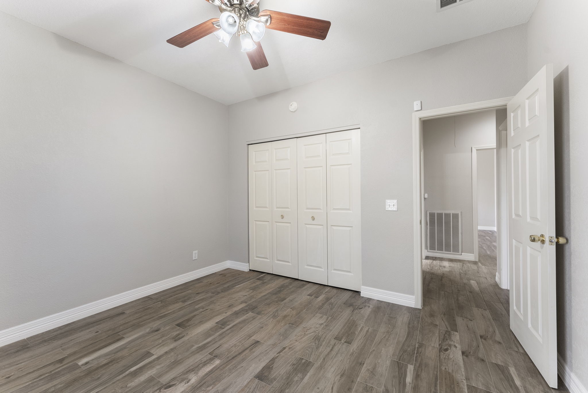 13942 Longstreet Road Willis, TX 77318 - Photo 21 of 46 wooden floor in an empty room with a window