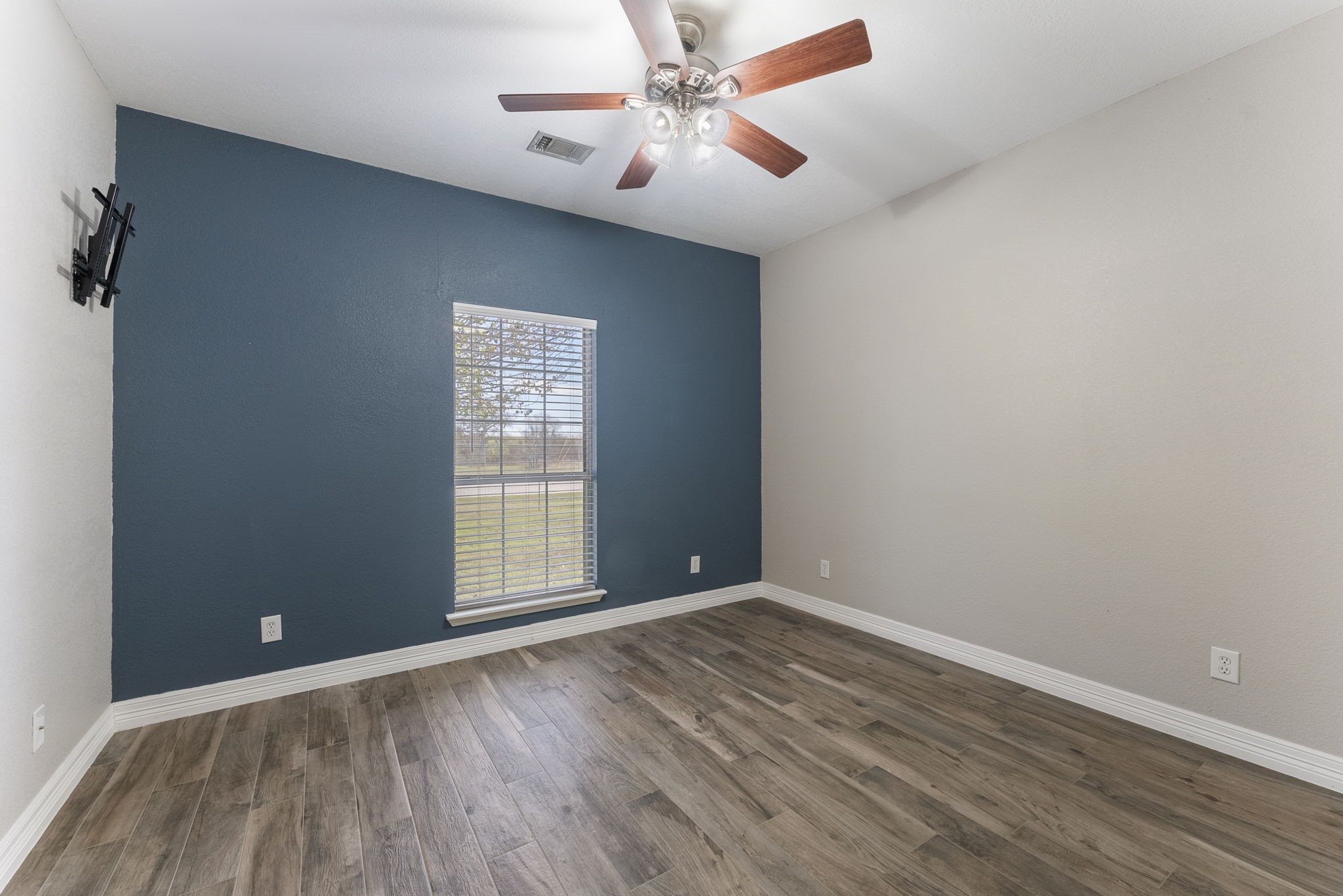 13942 Longstreet Road Willis, TX 77318 - Photo 22 of 46 wooden floor in an empty room with a window