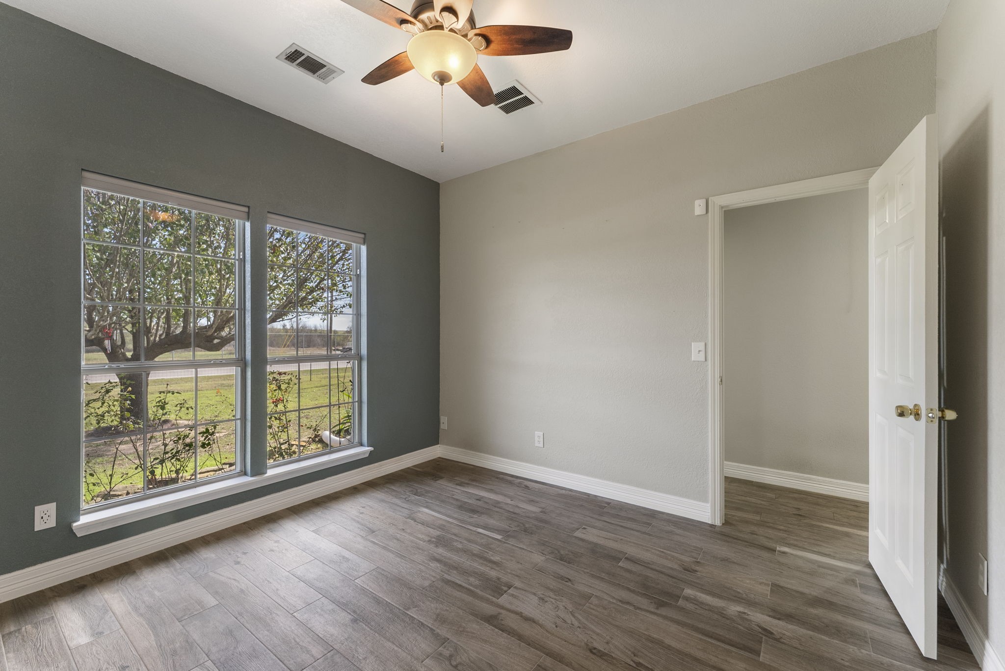 13942 Longstreet Road Willis, TX 77318 - Photo 23 of 46 wooden floor in an empty room with a window