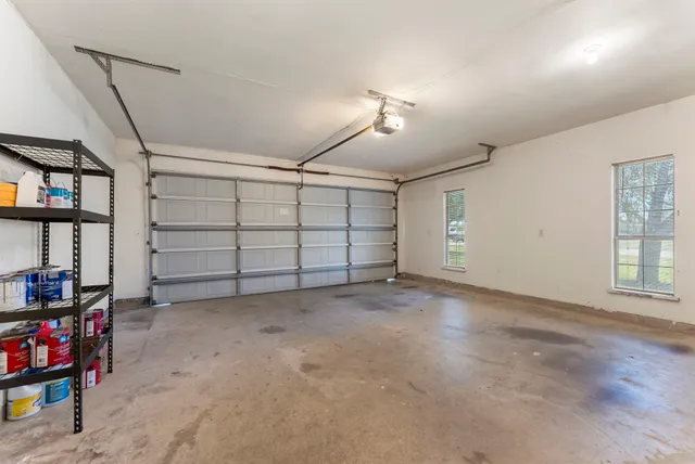 a view of a room with kitchen and fireplace wooden floor