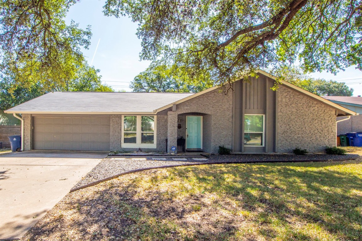 7007 West Gate Boulevard Austin, TX 78745 - Photo 1 of 15 a house view with swimming pool in front of it