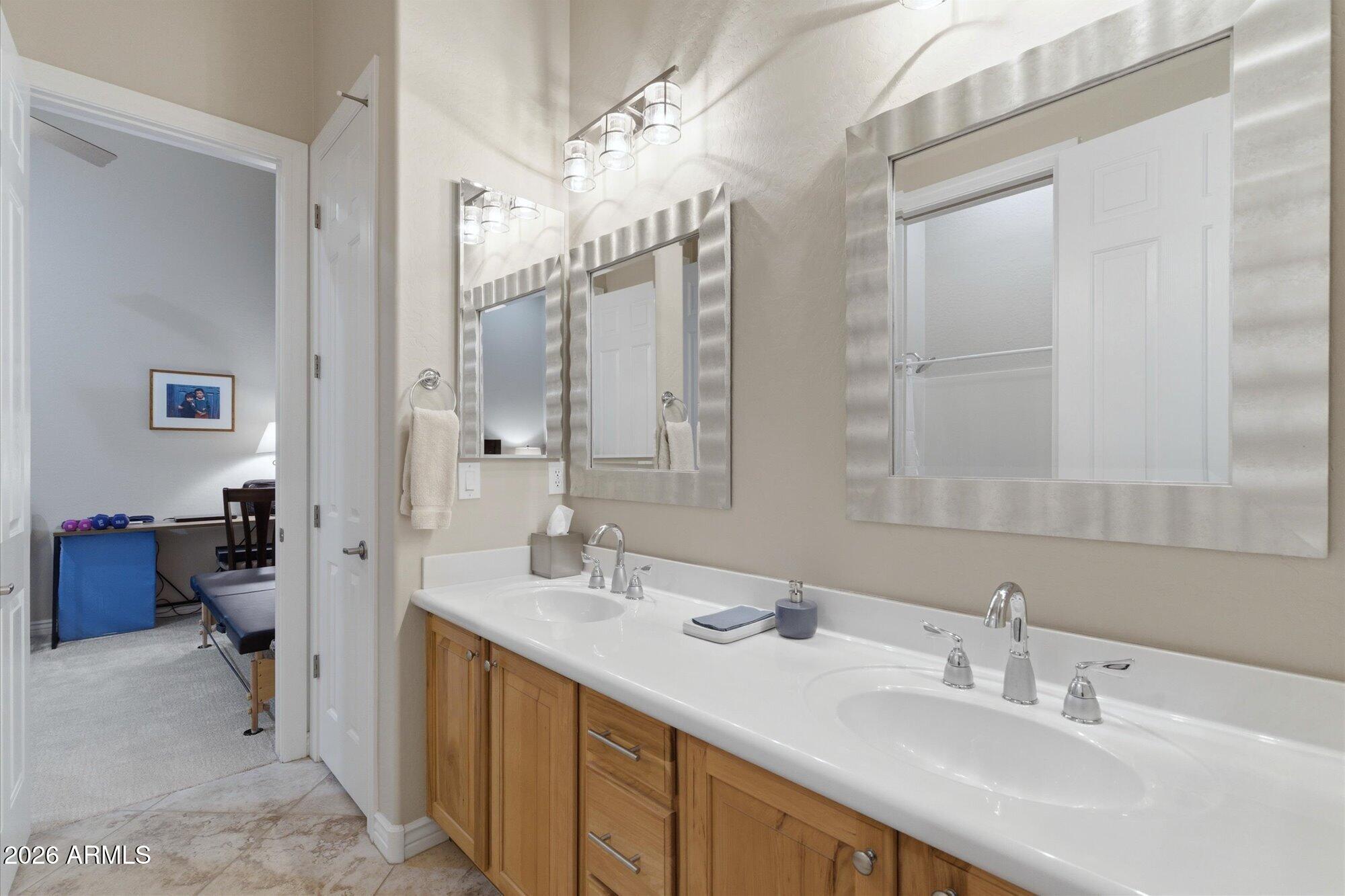 40322 North Hawk Ridge Trail Anthem, AZ 85086 - Photo 38 of 63 a bathroom with a double vanity sink mirror and double