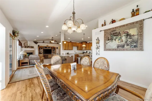 a very nice looking dining room with a table and chairs