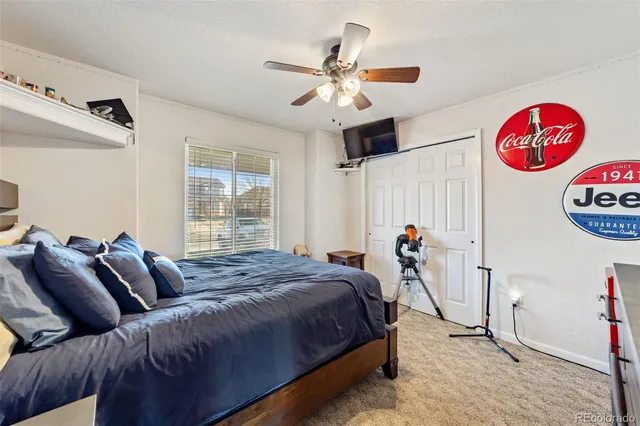 a bed room with a bed and a window