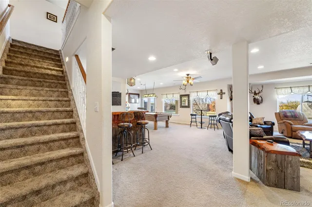 a view of a livingroom with furniture and toys