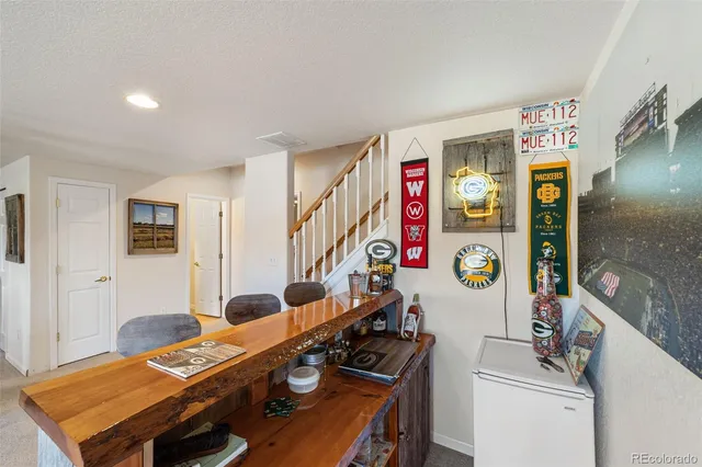 a room with furniture and musical instruments