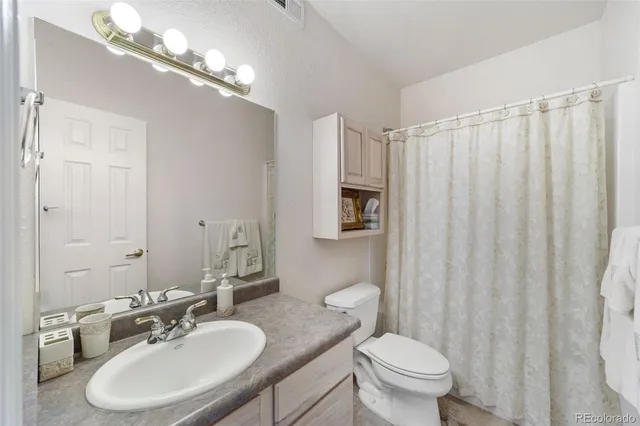 a spacious bedroom with a bed and window