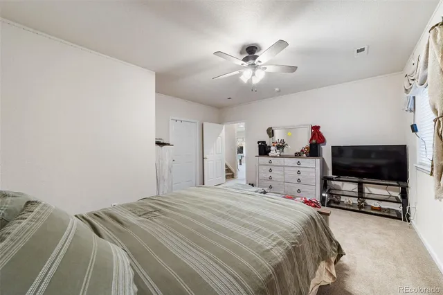 a view of a balcony with chairs and a table