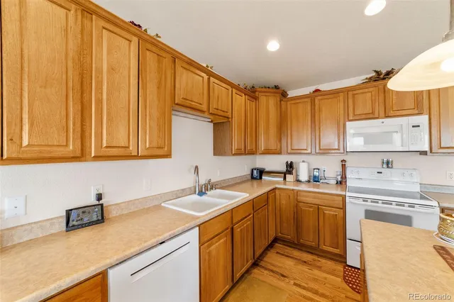 a kitchen with a sink cabinets and appliances