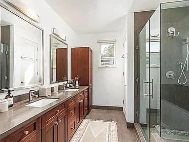 331 Sherman Road Santa Barbara, CA 93103 - Photo 11 of 18 a bathroom with a double vanity sink and mirror