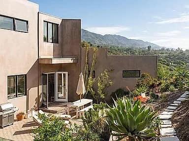 331 Sherman Road Santa Barbara, CA 93103 - Photo 3 of 18 a view of a house with a garden and plants