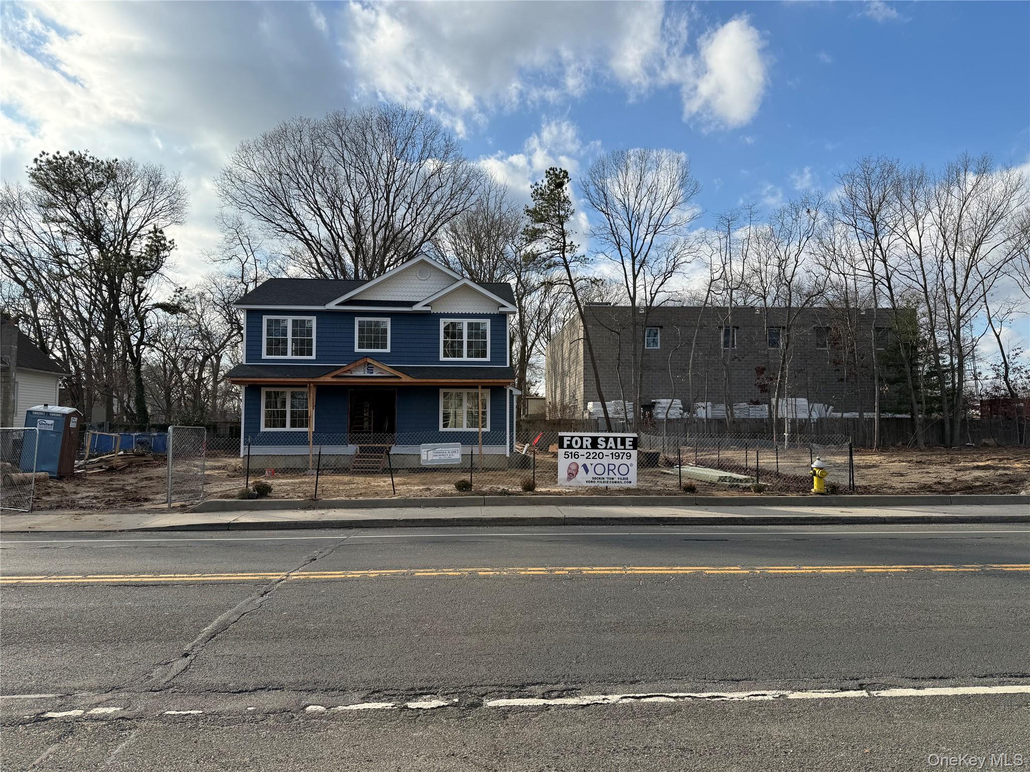 494 Islip Avenue Islip, NY 11751 - Photo 1 of 22 a view of a house next to a road and a yard
