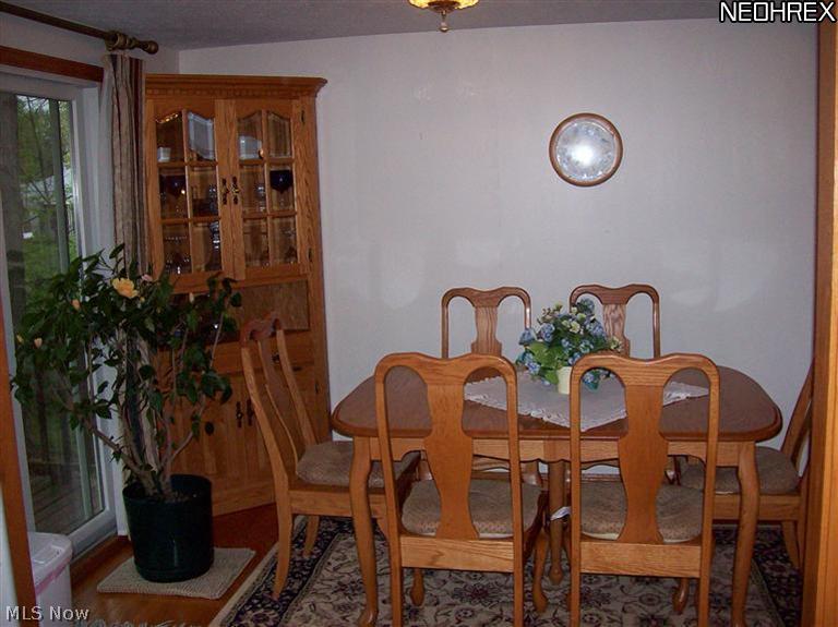 4750 James Road North Ridgeville, OH 44039 - Photo 5 of 23 Dinette are with oak flooring, sliding doors leads to a very large deck that was recently sanded down and repainted. Oak trim and wood encased entry way to Living room.
