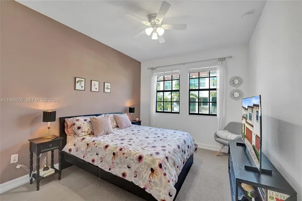 a bedroom with bed and a window