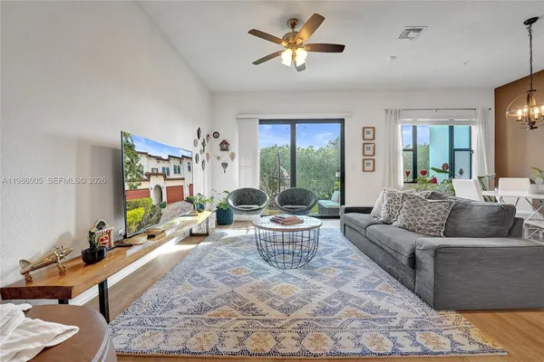 a living room with furniture and a large window