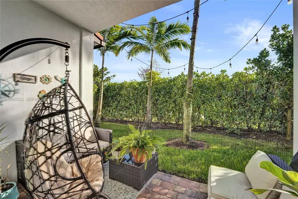 a potted plant sitting in front of a house