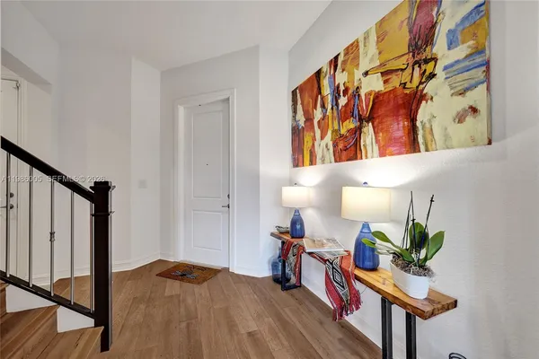 a bed room with furniture and a potted plant