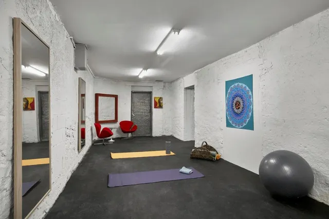 a room with gym equipment and a window
