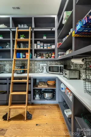 a kitchen with stainless steel appliances granite countertop a stove and a wooden cabinets