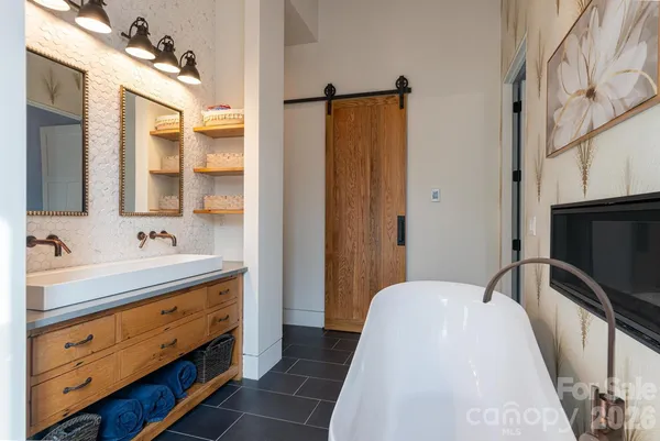 a bathroom with a sink a vanity and a mirror