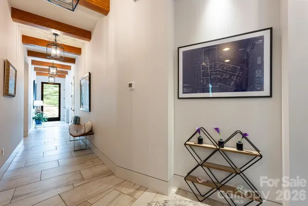 a view of an entryway with wooden floor