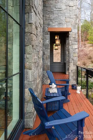 a backyard of a house with barbeque oven table and chairs