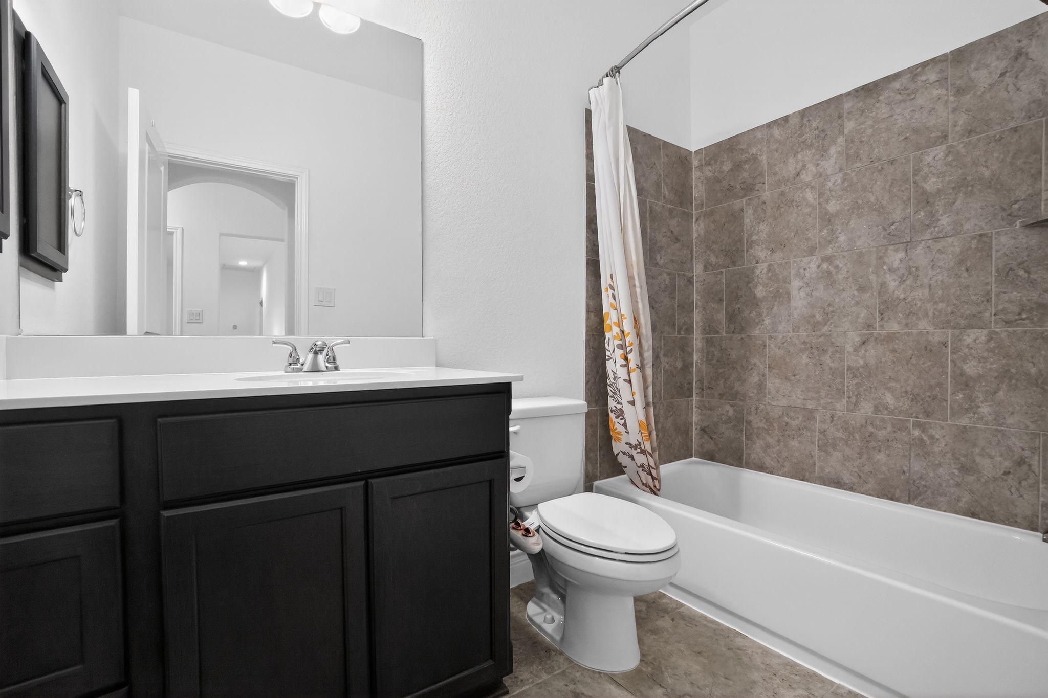400 Cortona Lane Georgetown, TX 78628 - Photo 26 of 40 Full bath featuring vanity and shower / bathtub combination with curtain