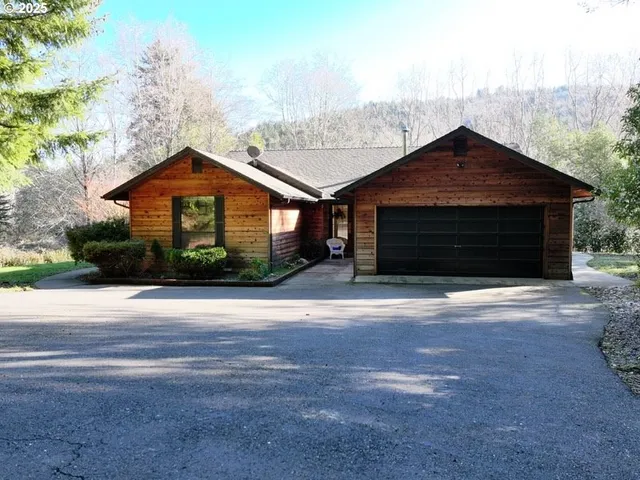 a garage room with washer and dryer