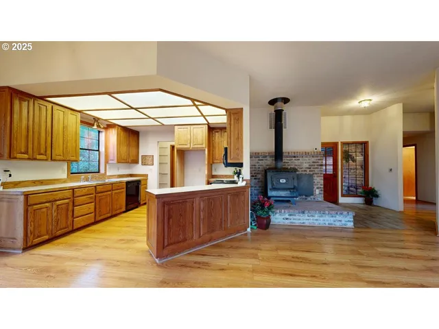 a kitchen with sink and cabinets