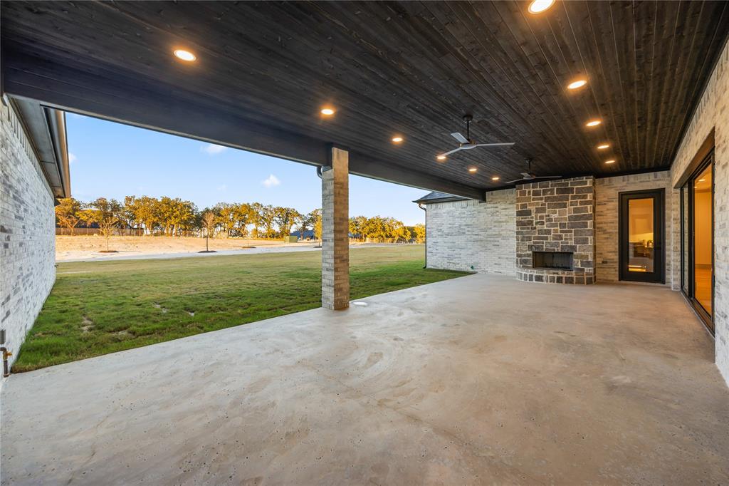 724 Cooper Trail Weatherford, TX 76087 - Photo 36 of 37 Covered outdoor living space featuring a dark wood-finish ceiling with recessed lighting and ceiling fans