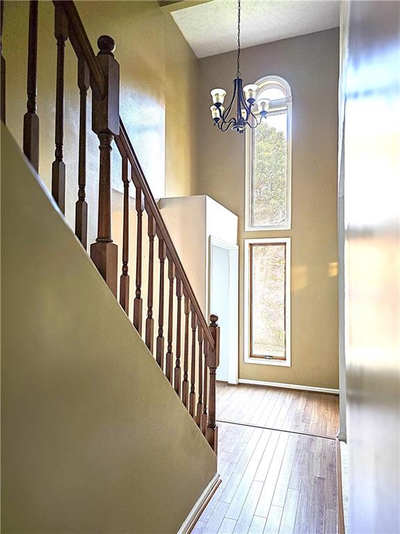 316 Stein Road Chicora, PA 16025 - Photo 7 of 41 a view of a hallway with windows and chandelier