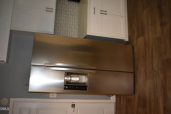 a white toilet sitting next to a white sink