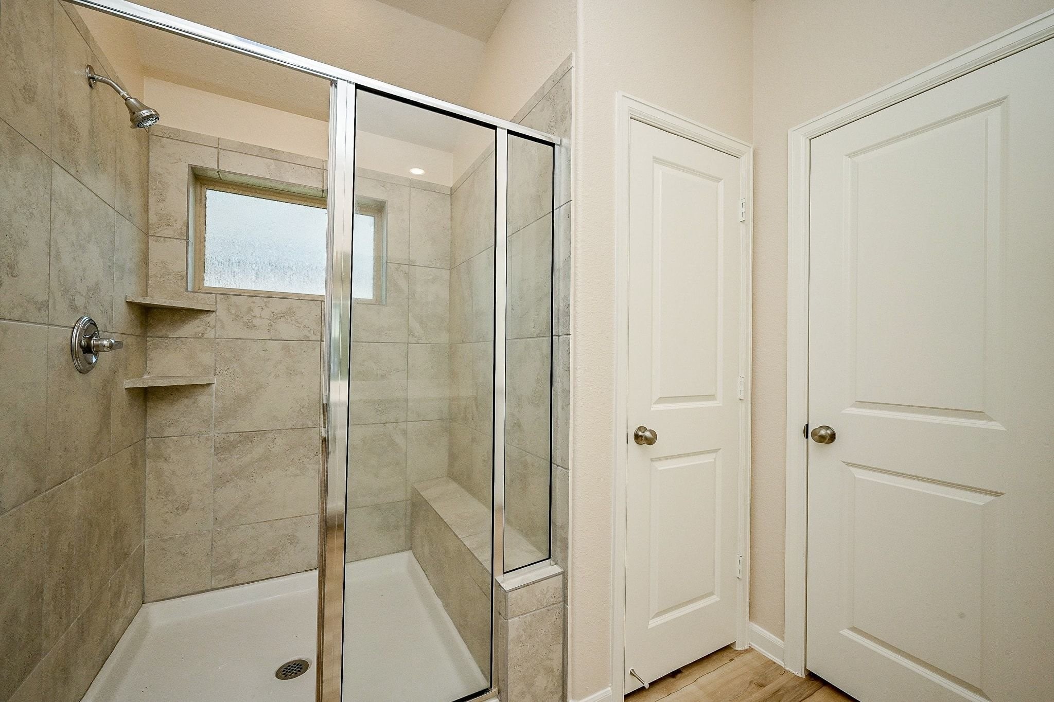 3715 Homestead Ridge Lane Richmond, TX 77406 - Photo 16 of 20 a bathroom with a glass shower door