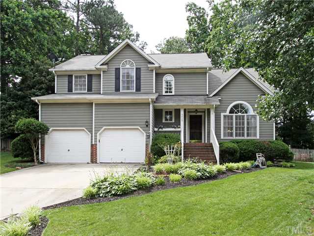 5629 Barham Court Raleigh, NC 27613 - Photo 1 of 17 a front view of a house with garden