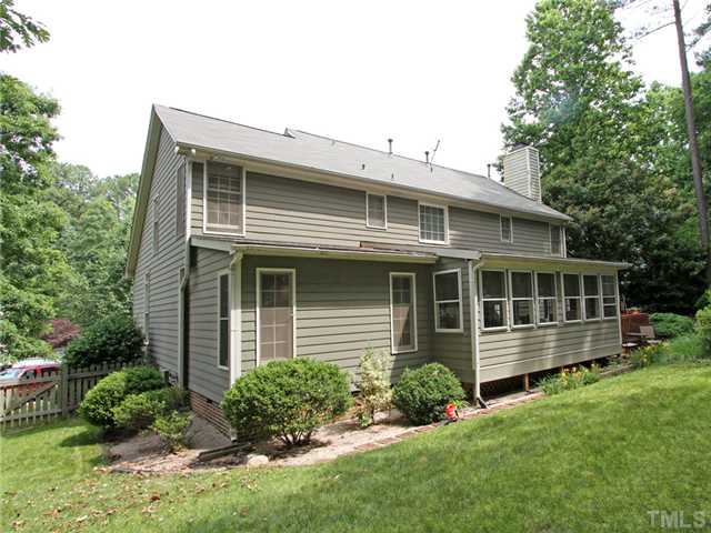 5629 Barham Court Raleigh, NC 27613 - Photo 2 of 17 a front view of a house with a yard table and chairs