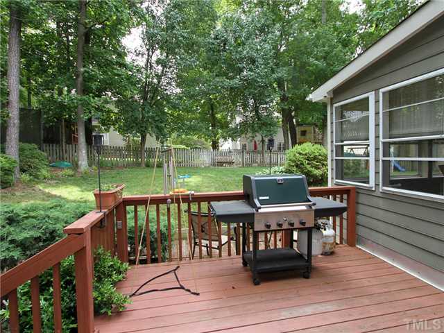 5629 Barham Court Raleigh, NC 27613 - Photo 3 of 17 a view of a deck with chairs and a yard