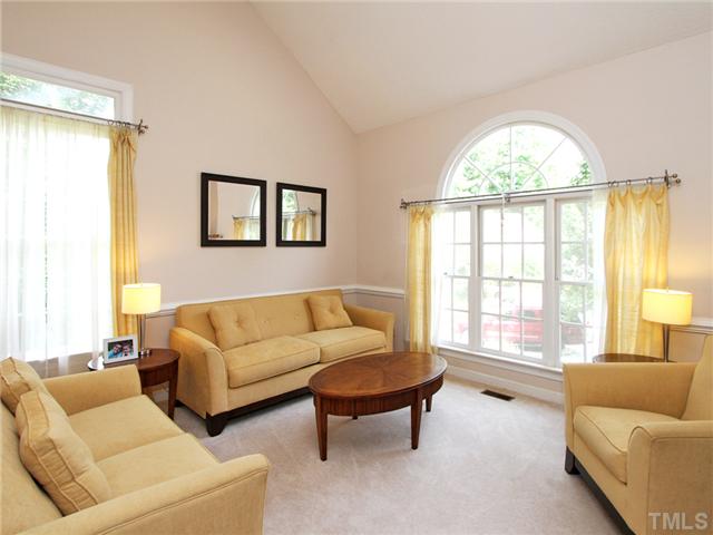 5629 Barham Court Raleigh, NC 27613 - Photo 5 of 17 a living room with furniture and a large window