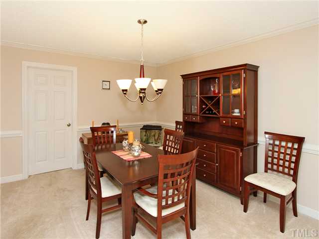 5629 Barham Court Raleigh, NC 27613 - Photo 6 of 17 a view of a dining room with furniture