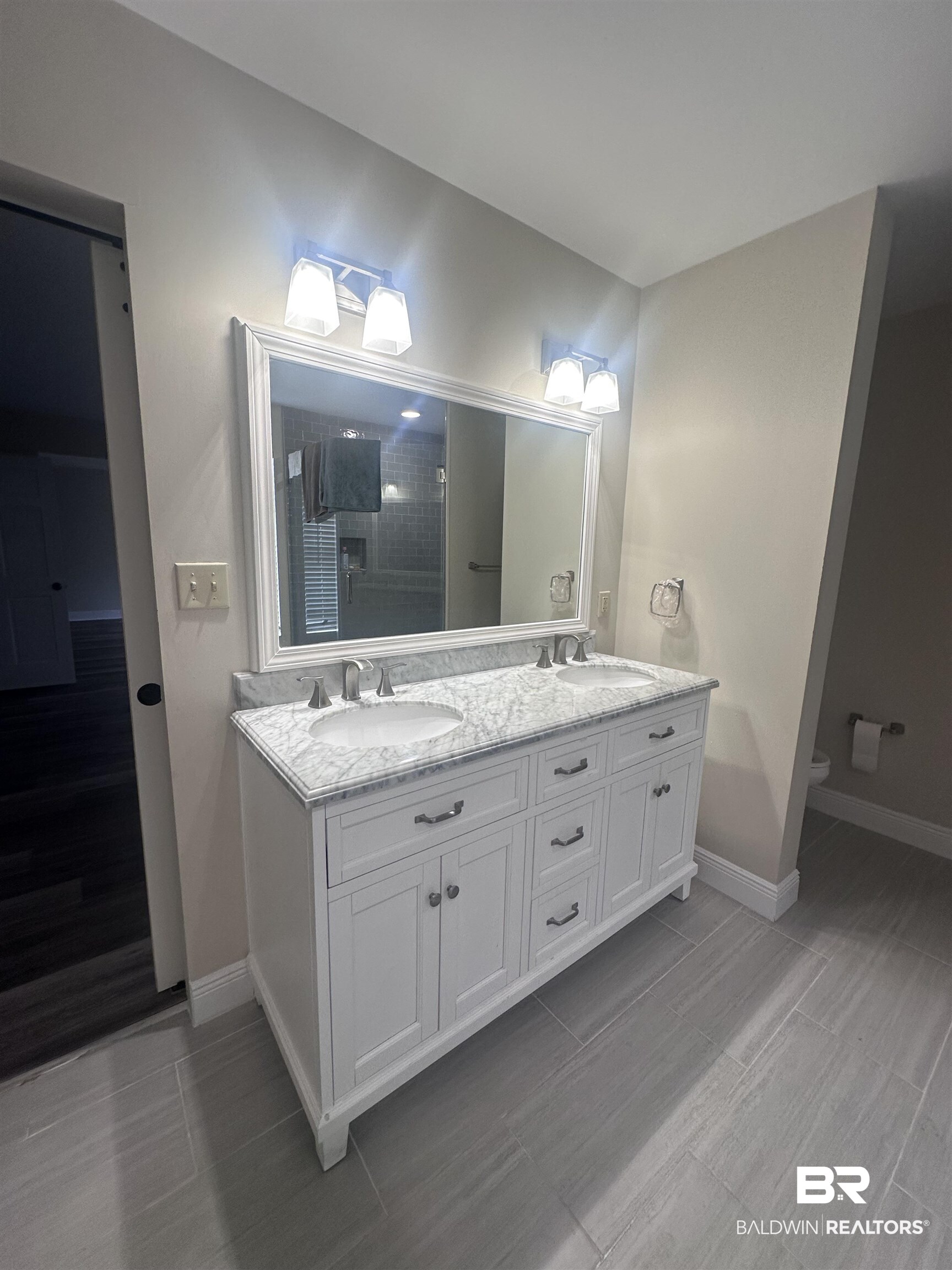 2785 Sowell Road Brewton, AL 36426 - Photo 13 of 24 Bathroom with double vanity and wood finish floors